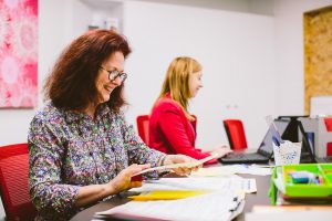 A Caxton staff lawyer inspects a document